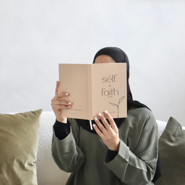 Muslim woman holding The Self and Faith Journal Beige - 90-day guided Islamic journal lifestyle photo #color_beige