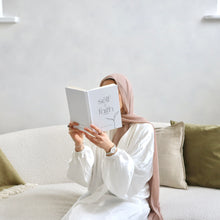 Hand holding The Self and Faith Journal Pure White - guided Islamic journal for spiritual growth #color_pure-white