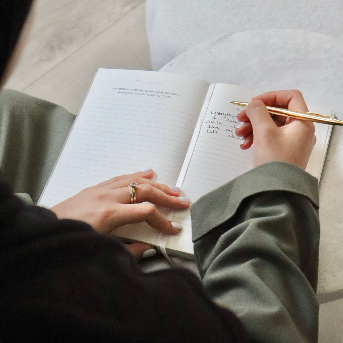 Person writing in The Self and Faith Journal Beige with gold pen - daily Islamic journaling and self-reflection in practice #color_beige