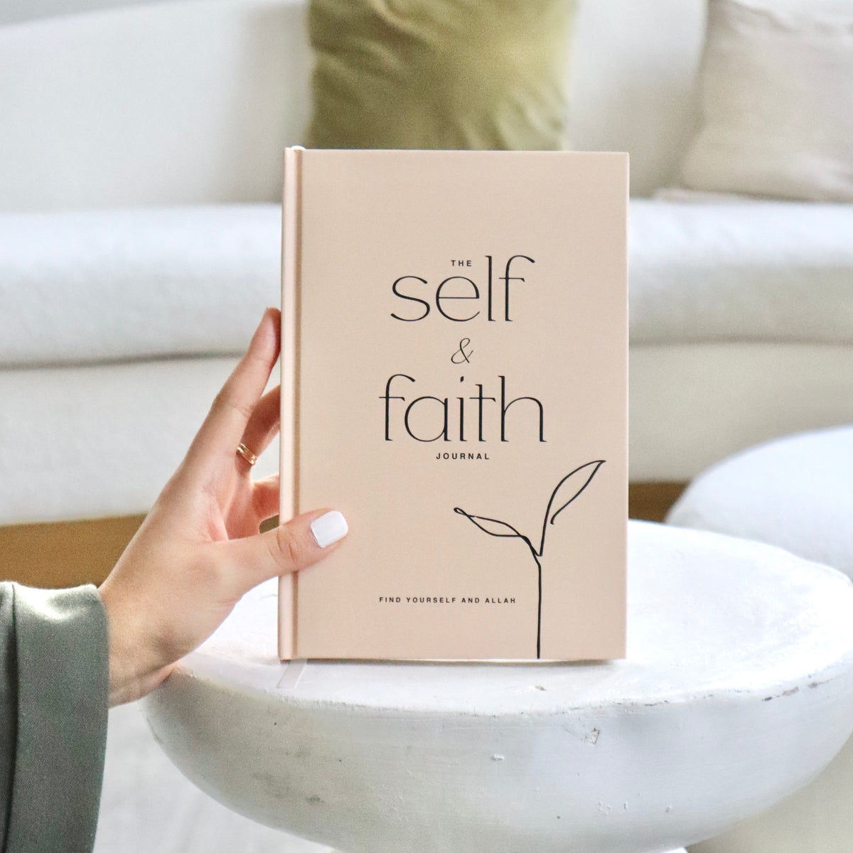 Hand holding The Self and Faith Journal Beige - 90-day guided Islamic journal for spiritual growth and self-reflection #color_beige